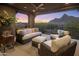 Enjoy sunset views from this covered patio with comfortable wicker furniture at 26698 N 104Th Way, Scottsdale, AZ 85262