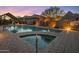 Community pool and spa with lounge chairs and a covered patio at 26698 N 104Th Way, Scottsdale, AZ 85262