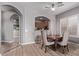 Casual dining area with wood table and chairs, adjacent to kitchen at 26818 N 66Th Ln, Phoenix, AZ 85083