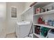 Laundry room offers shelving and ample storage space for cleaning supplies at 26818 N 66Th Ln, Phoenix, AZ 85083