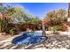 Private kidney shaped pool surrounded by desert landscaping at 26818 N 66Th Ln, Phoenix, AZ 85083