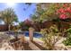 Beautiful kidney shaped pool with a tranquil desert landscape at 26818 N 66Th Ln, Phoenix, AZ 85083