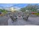 Relaxing backyard with fire pit and desert landscaping at 29308 N 132Nd Ln, Peoria, AZ 85383