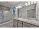 Modern bathroom with double sinks and a walk-in shower at 29308 N 132Nd Ln, Peoria, AZ 85383