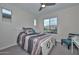 Cozy bedroom with a full-size bed and sitting area at 29308 N 132Nd Ln, Peoria, AZ 85383