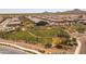 Aerial view of a community dog park with a shaded seating area at 29308 N 132Nd Ln, Peoria, AZ 85383