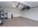 Garage with overhead storage and epoxy flooring at 29308 N 132Nd Ln, Peoria, AZ 85383