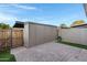 Backyard with storage shed and brick patio at 2968 E Clarendon Ave, Phoenix, AZ 85016