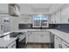 Modern kitchen featuring stainless steel appliances and white shaker cabinets at 2968 E Clarendon Ave, Phoenix, AZ 85016