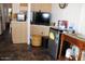 Kitchen area with cabinets, appliances, and a small fridge at 306 S Recker Rd # 267, Mesa, AZ 85206