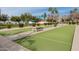 Community bocce ball court with seating and landscaping at 3301 S Goldfield Rd # 5027, Apache Junction, AZ 85119