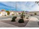 Residential street view with desert landscaping and mountain backdrop at 3301 S Goldfield Rd # 5027, Apache Junction, AZ 85119