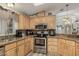 Modern kitchen with granite countertops and wood cabinets at 3301 S Goldfield Rd # 5027, Apache Junction, AZ 85119