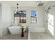 Spa-like bathroom with a large soaking tub and walk-in shower at 3427 E Campbell Ave, Phoenix, AZ 85018