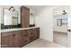 Contemporary bathroom boasts double vanity, and a view into bedroom at 3427 E Campbell Ave, Phoenix, AZ 85018