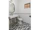 Modern powder room with hexagon tile floor and white vanity at 3427 E Campbell Ave, Phoenix, AZ 85018