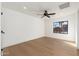 Bright bedroom featuring light wood floors and a large window at 3427 E Campbell Ave, Phoenix, AZ 85018