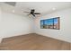 Spacious bedroom with hardwood floors and large window at 3427 E Campbell Ave, Phoenix, AZ 85018