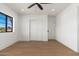 Bright bedroom with hardwood floors and a large window at 3427 E Campbell Ave, Phoenix, AZ 85018