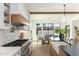 Modern kitchen with farmhouse sink and breakfast bar at 3427 E Campbell Ave, Phoenix, AZ 85018