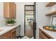 Bright pantry with wood cabinets and open shelving at 3427 E Campbell Ave, Phoenix, AZ 85018