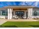 The covered patio features plush outdoor furniture and a ceiling fan at 3427 E Campbell Ave, Phoenix, AZ 85018