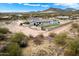 Aerial view of a large estate with a pool and mountain backdrop at 34709 N 48Th St, Cave Creek, AZ 85331