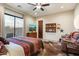 Rustic-style bedroom with a large TV and a cowhide rug at 34709 N 48Th St, Cave Creek, AZ 85331