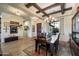 Elegant dining room with rustic wood table and chandelier at 34709 N 48Th St, Cave Creek, AZ 85331