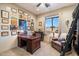 Home office with built-in desk and comfortable seating at 34709 N 48Th St, Cave Creek, AZ 85331