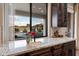 Kitchen with a window overlooking the backyard pool and mountains at 34709 N 48Th St, Cave Creek, AZ 85331