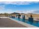 Modern pool and waterfall feature in a desert landscape at 34709 N 48Th St, Cave Creek, AZ 85331