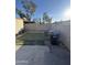 Small backyard with artificial turf and a trash bin at 3646 N 69Th Ave # 55, Phoenix, AZ 85033