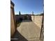 Small backyard with storage shed and gate access at 3646 N 69Th Ave # 55, Phoenix, AZ 85033