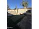 Small backyard with artificial turf and block wall at 3646 N 69Th Ave # 55, Phoenix, AZ 85033