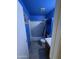 Bright blue bathroom with a shower/tub combo, toilet and vanity at 3646 N 69Th Ave # 55, Phoenix, AZ 85033