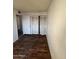 Bedroom with wood-look flooring and double door closet at 3646 N 69Th Ave # 55, Phoenix, AZ 85033