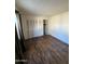 Bright bedroom with double doors to the closet at 3646 N 69Th Ave # 55, Phoenix, AZ 85033