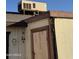 Exterior shed with damaged door and AC unit at 3646 N 69Th Ave # 55, Phoenix, AZ 85033