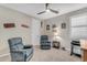 Relaxing bedroom with two recliner chairs and movie theme at 37029 N Andravida Dr, San Tan Valley, AZ 85140