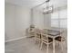 Bright dining room with farmhouse table and chairs, and white shutters at 37029 N Andravida Dr, San Tan Valley, AZ 85140