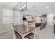 Charming dining area with farmhouse table and chairs near kitchen at 37029 N Andravida Dr, San Tan Valley, AZ 85140