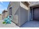 Front entry with teal chairs and a home decor sign at 37029 N Andravida Dr, San Tan Valley, AZ 85140