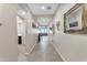 Bright hallway with tile floors, leading to living room at 37029 N Andravida Dr, San Tan Valley, AZ 85140