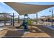 Shaded playground with slide and play structure at 37029 N Andravida Dr, San Tan Valley, AZ 85140