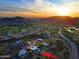 Aerial view of a home with a large backyard and pool, situated in a neighborhood with mountain views at 38844 N Spur Cross Rd, Cave Creek, AZ 85331