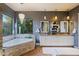 Elegant bathroom with double vanity, soaking tub, and stone accents at 38844 N Spur Cross Rd, Cave Creek, AZ 85331