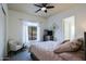 Bright bedroom with a queen-size bed and ceiling fan at 38844 N Spur Cross Rd, Cave Creek, AZ 85331