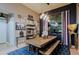 Casual dining area with rustic wooden table and eclectic wall decor at 38844 N Spur Cross Rd, Cave Creek, AZ 85331