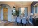 Spacious dining area with a dark wood table and blue chairs at 38844 N Spur Cross Rd, Cave Creek, AZ 85331